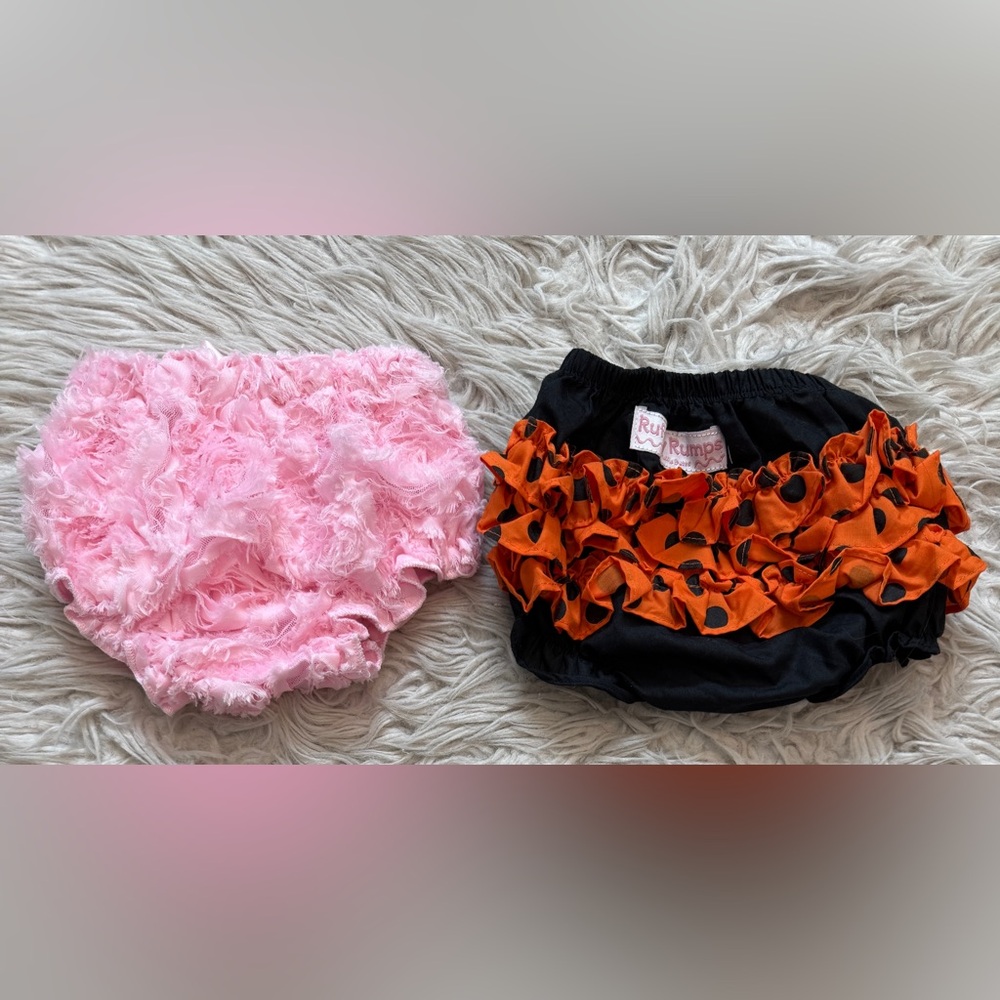 Ruffle diaper covers 0 - 6M.  One pink & one Halloween themed!